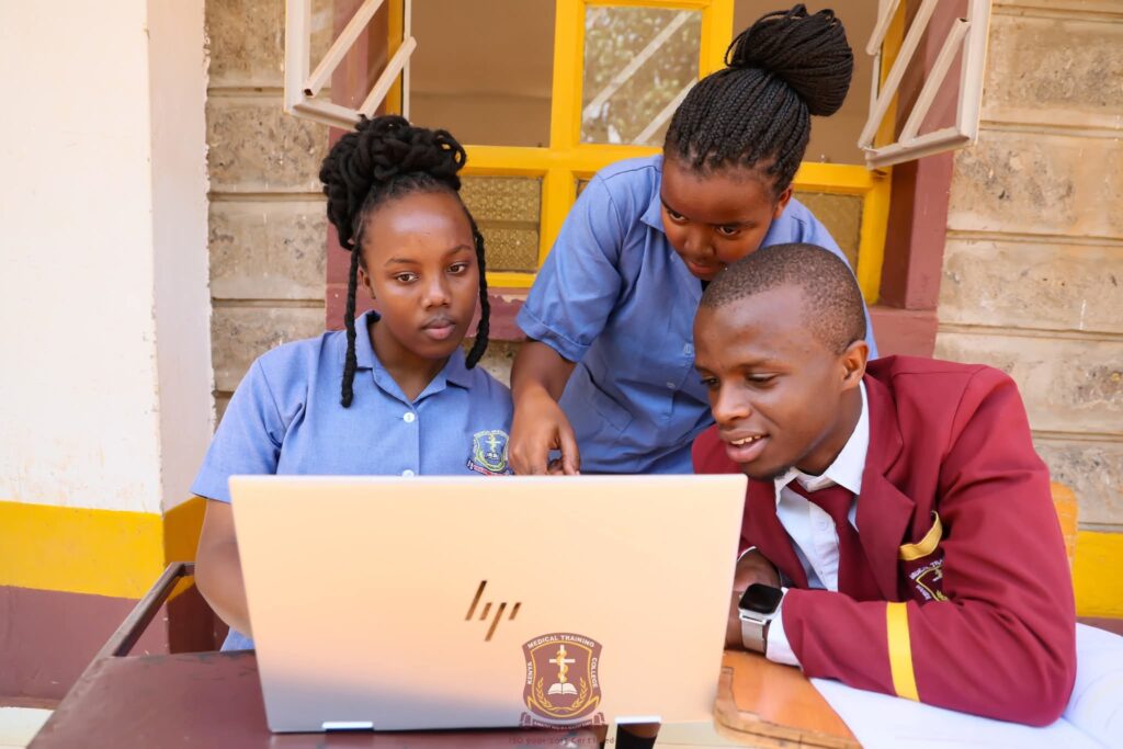 Learners at KMTC using a laptop