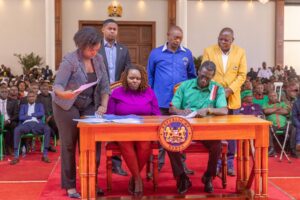 KNUT Secretary General Collins Oyuu and Affordable Housing officials sign the 20% housing scheme agreement at State House on September 13, 2025. (Photo: State House Kenya)